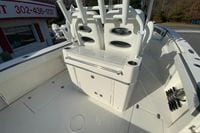 2026 Cobia 285 Center Console boat interior with seating and storage compartments.