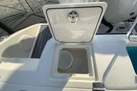 2026 Cobia 285 Center Console boat with open storage compartment on deck.