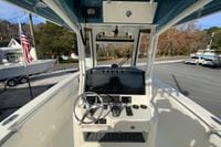2026 Cobia 285 Center Console boat dashboard with steering wheel and controls.