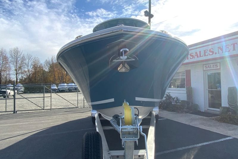 2026 Cobia 285 Center Console boat on trailer in dealership lot.