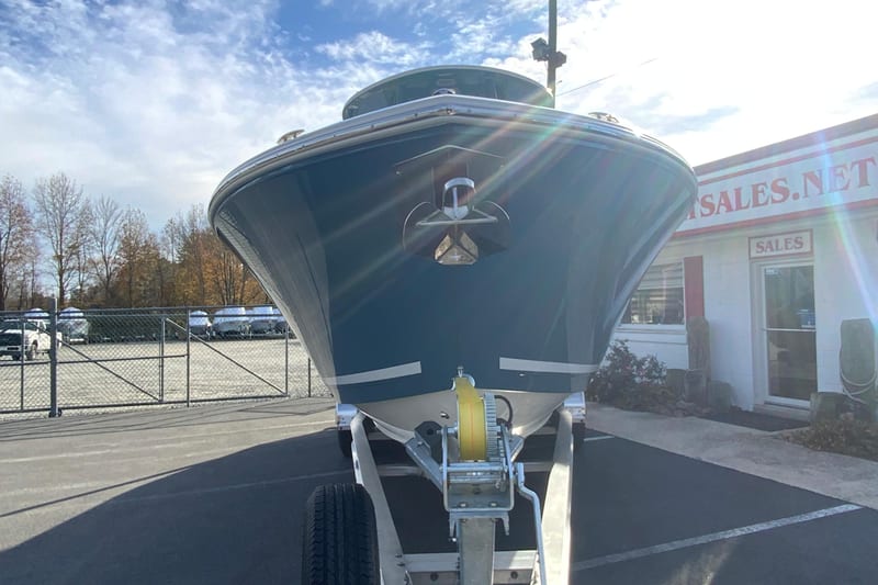 2026 Cobia 285 Center Console boat on trailer in dealership lot.