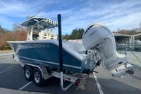 2026 Cobia 285 Center Console boat with Yamaha engine on trailer.