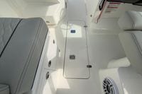 Interior of 2026 Pursuit DC 266 Dual Console boat, featuring seating and storage compartments.