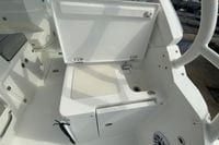 2026 Pursuit DC 266 Dual Console boat interior with open storage compartment and sink.