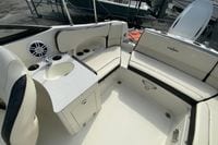 2023 Stingray 231 DC boat interior with seating, sink, and speaker system.