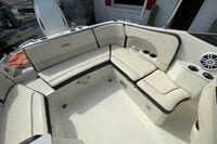 2023 Stingray 231 DC boat interior with cushioned seating and cup holders.