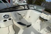2023 Stingray 231 DC boat interior with seating, cup holders, and speaker system.