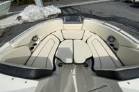 2023 Stingray 231 DC boat interior with cream seating and cup holders.