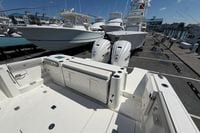 2026 Pursuit S 358 Sport boat with dual Yamaha engines docked at marina.