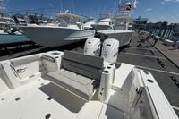 2026 Pursuit S 358 Sport boat with dual Yamaha engines docked at marina.