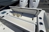 2026 Pursuit S 358 Sport boat with open storage compartment and dual Yamaha engines.