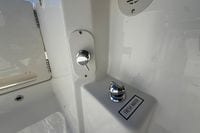 Fresh water outlet on 2026 Pursuit S 358 Sport boat, featuring chrome fixtures.
