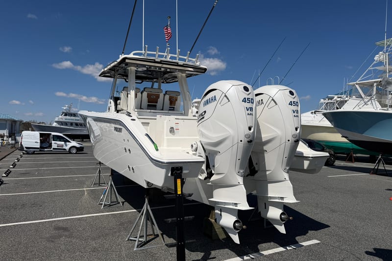 2026 Pursuit S 358 Sport boat with twin Yamaha 450 V8 engines in a marina.