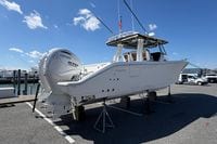 2026 Pursuit S 358 Sport boat with Yamaha engines on display outdoors.