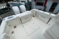 2026 Pursuit DC 286 Dual Console boat interior with storage compartments and twin engines.