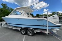 2026 Pursuit DC 286 Dual Console boat on trailer, featuring Yamaha engines.