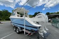 2026 Pursuit DC 286 Dual Console boat with Yamaha engines on a trailer.