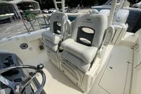 2027 Cobia 320 Center Console boat interior with dual cushioned seats.