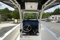 2027 Pursuit S 268 Sport boat cockpit with steering wheel and control panel.