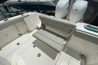 2027 Pursuit S 268 Sport boat interior with foldable seating and dual outboard engines.