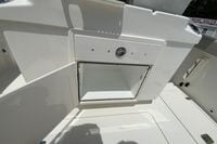 2027 Pursuit S 268 Sport boat storage compartment with open hatch, showcasing interior space.