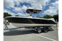 2027 Pursuit S 268 Sport boat on trailer under a partly cloudy sky.