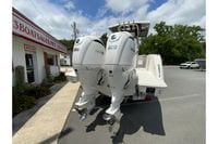 2027 Pursuit S 268 Sport boat with twin Yamaha engines at a sales lot.