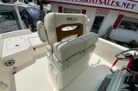 2023 Pathfinder 2400 TRS boat seat and helm at dealership.