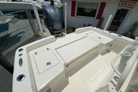 2023 Pathfinder 2400 TRS boat deck with storage compartments and outboard motor.