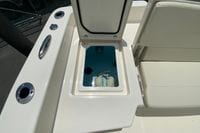 Open storage compartment on 2023 Pathfinder 2400 TRS boat, featuring coiled rope inside.