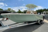 2023 Pathfinder 2400 TRS boat on trailer, parked outdoors under a clear sky.