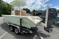 2023 Pathfinder 2400 TRS boat with Yamaha engine on trailer, parked outdoors.