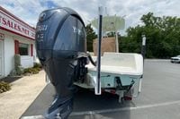 2023 Pathfinder 2400 TRS boat with Yamaha 300 V6 engine, parked outdoors.