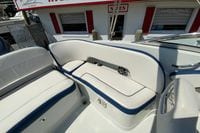 2019 Crownline Eclipse E235 XS boat interior with white and blue seating.