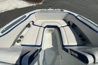 2019 Crownline Eclipse E235 XS boat interior with white and blue seating.