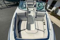 2019 Crownline Eclipse E235 XS boat interior with white seating and blue accents.