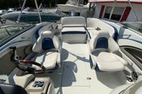 2019 Crownline Eclipse E235 XS boat interior with white and blue seating.