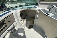 2019 Crownline Eclipse E235 XS boat interior with open compartment and seating area.