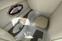 2019 Crownline Eclipse E235 XS boat interior with sink and portable toilet.
