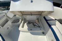2019 Crownline Eclipse E235 XS boat storage compartment with rope and chain.