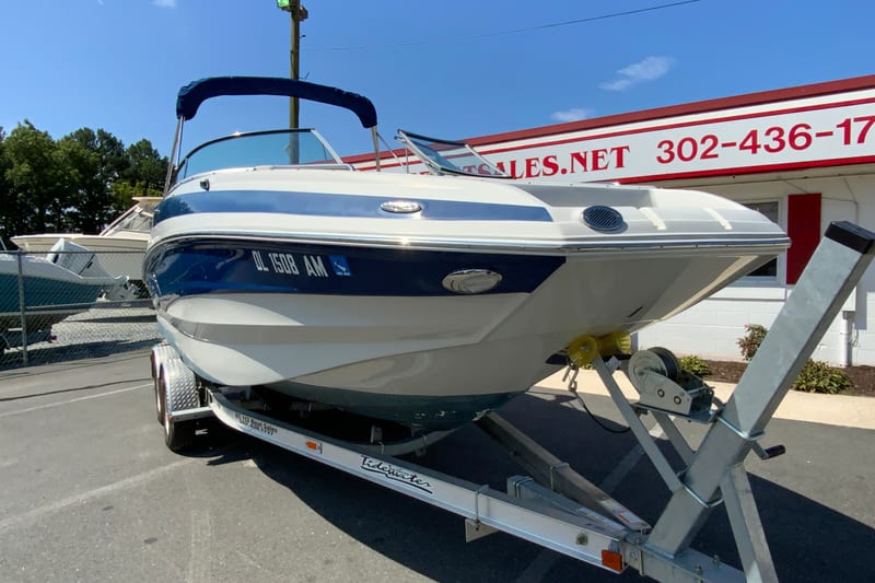 2019 Crownline Eclipse E235 XS boat on trailer at dealership.