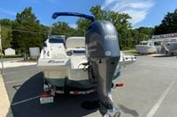 2019 Crownline Eclipse E235 XS boat with Yamaha 200 outboard motor in a parking lot.