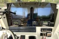 2018 Cobia 301 Center Console dashboard with Garmin navigation displays and controls.