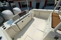 2018 Cobia 301 Center Console boat interior with seating and storage compartments.