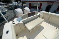 2018 Cobia 301 Center Console boat interior with seating and twin engines.