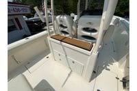 2018 Cobia 301 Center Console boat interior with seating and storage compartments.