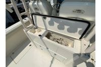 2018 Cobia 301 Center Console boat storage compartment with rope inside.