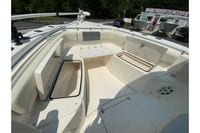 2018 Cobia 301 Center Console boat interior with open storage compartments.