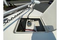 2018 Cobia 301 Center Console boat storage compartment with wiring and equipment.
