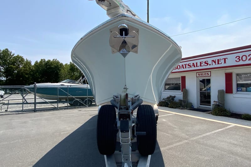 2018 Cobia 301 Center Console boat on trailer at dealership.